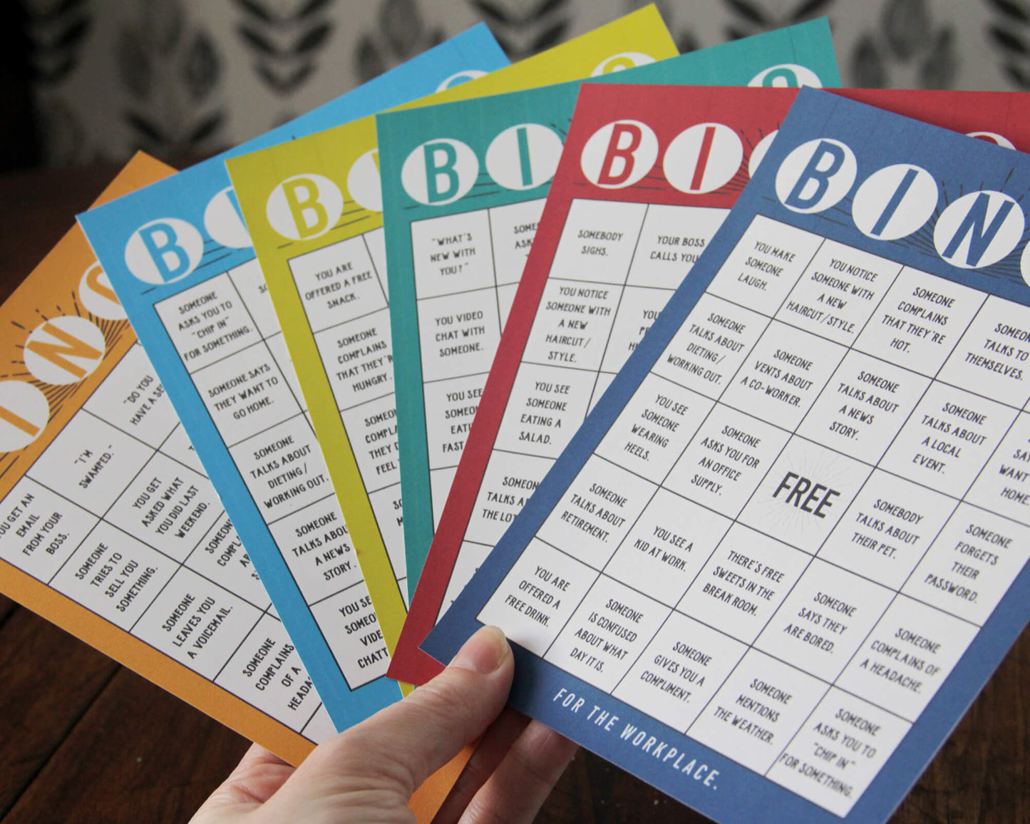 Team Building Bundle. Collage of 7 different team building activities including Wellness Bingo, Find Someone Who Bingo, Workplace Scavenger Hunt, 2 Truths and a Lie, Decision Quest: Fallout Shelter, Paper Telephone, and Bingo for the Workplace.