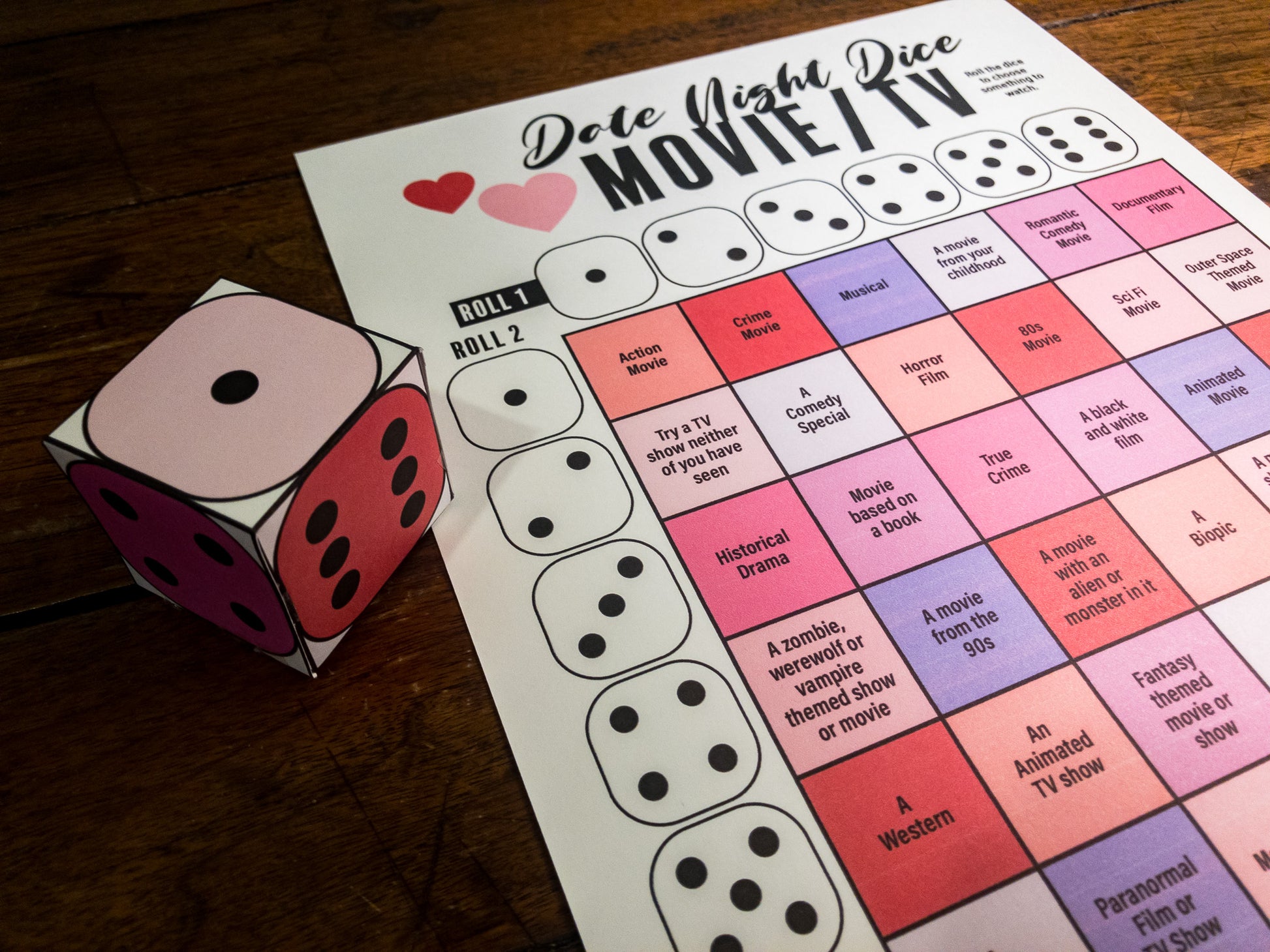 Date Night Dice printable activity where you roll a 3D paper dice to choose dinner, a movie, and an activity for date night.