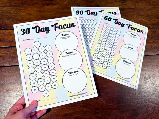 A 30, 60, and 90 Day Focus Worksheet for tracking daily goals, challenges, habits, and more. Each sheet has a space for writing down your focus, intent, and outcome. There are circles you can fill in or cross off each day to indicate you completed your daily focus goal.