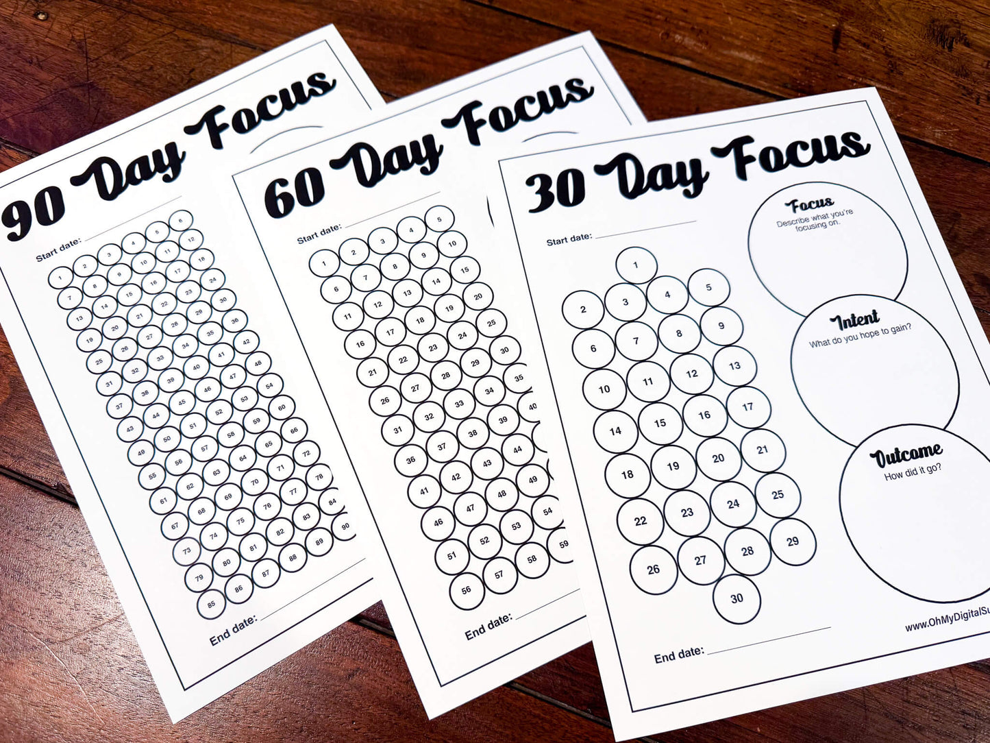 A 30, 60, and 90 Day Focus Worksheet for tracking daily goals, challenges, habits, and more. Each sheet has a space for writing down your focus, intent, and outcome. There are circles you can fill in or cross off each day to indicate you completed your daily focus goal.